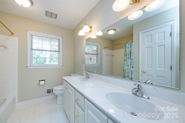 full bathroom with a healthy amount of sunlight, visible vents, and a sink