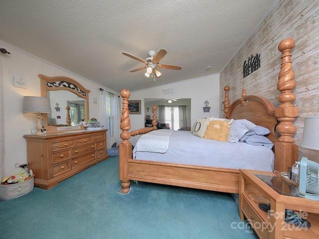 carpeted bedroom with crown molding, a textured ceiling, and ceiling fan