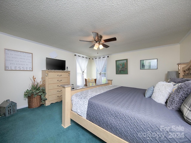 bedroom with ceiling fan, carpet floors, ornamental molding, and a textured ceiling