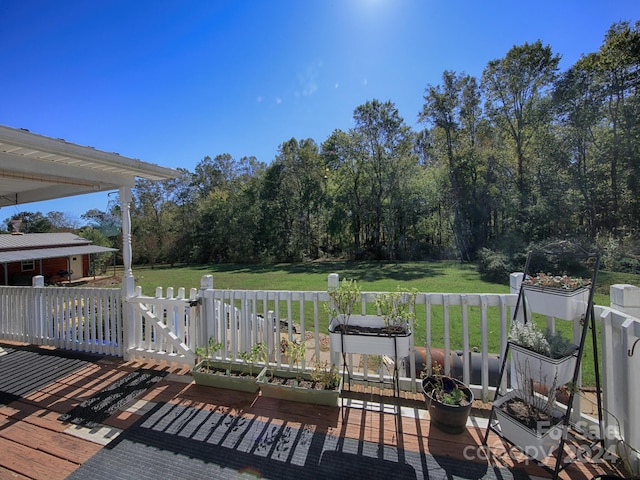 deck featuring a yard