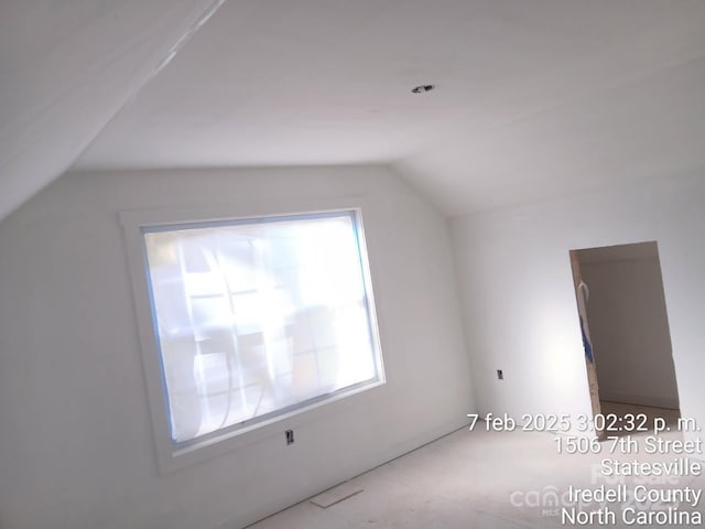 additional living space with vaulted ceiling