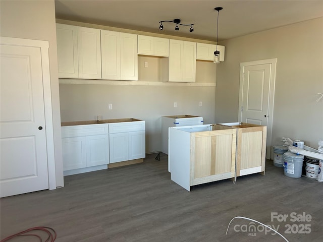 kitchen featuring white cabinets and dark wood-style floors