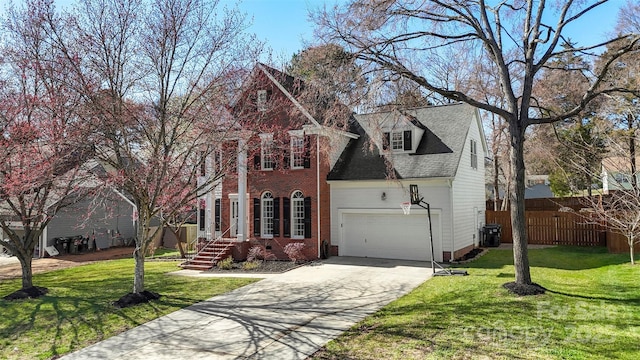 view of front of property with concrete driveway, an attached garage, a front yard, crawl space, and fence