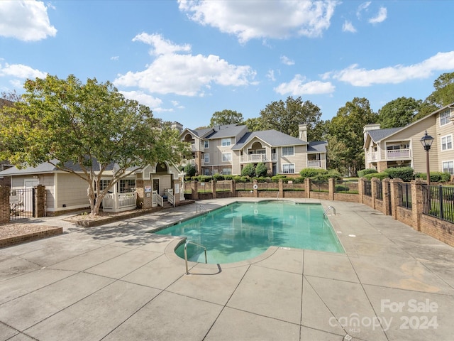 view of pool featuring a patio