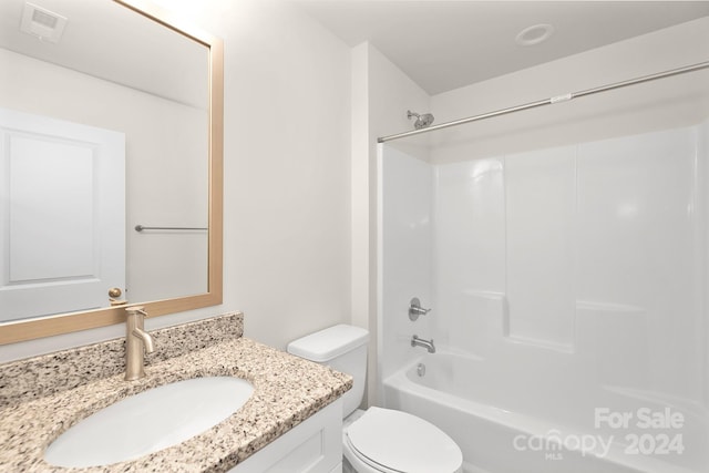 full bathroom featuring vanity, shower / tub combination, and toilet