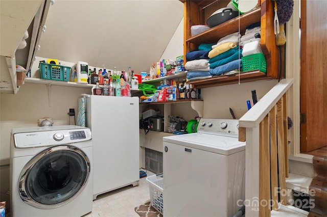 laundry room featuring washing machine and clothes dryer