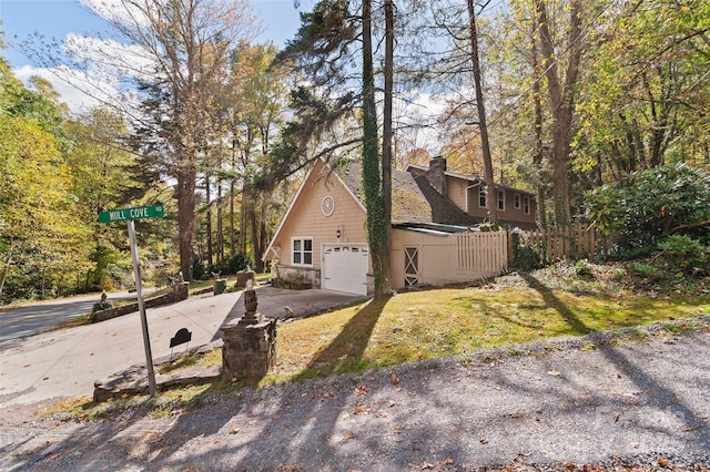 view of property exterior with a garage