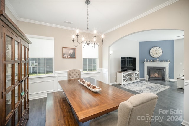 dining space with dark hardwood / wood-style floors and crown molding