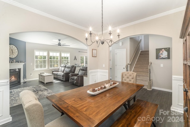 dining area with ornamental molding, ceiling fan, and dark hardwood / wood-style floors