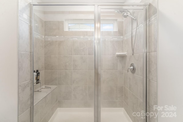 bathroom featuring an enclosed shower