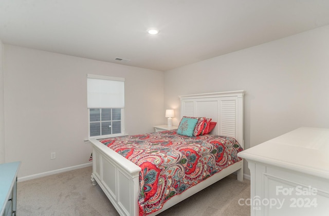 bedroom with light colored carpet