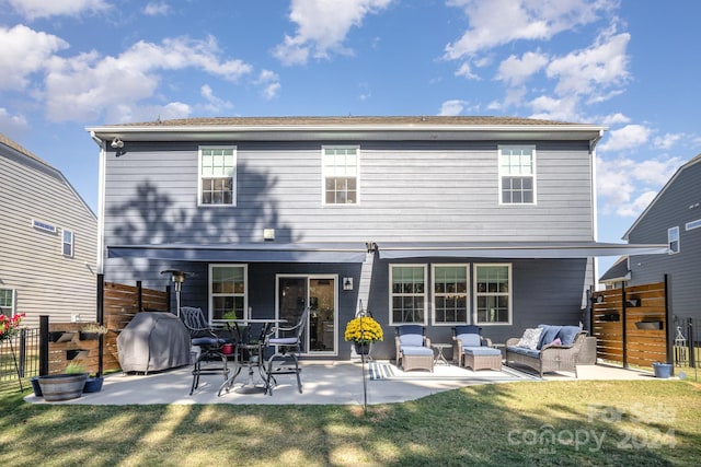 back of house featuring an outdoor living space, a lawn, and a patio