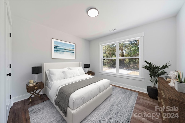 bedroom featuring dark hardwood / wood-style floors