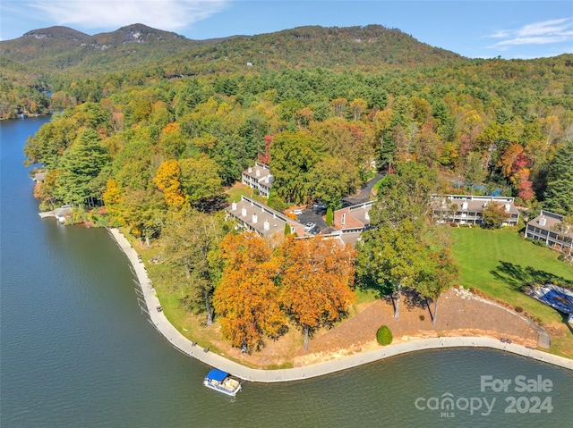 aerial view featuring a water and mountain view