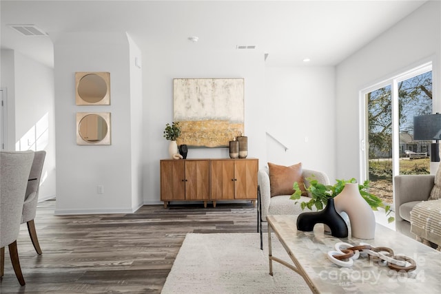 living area with dark hardwood / wood-style flooring