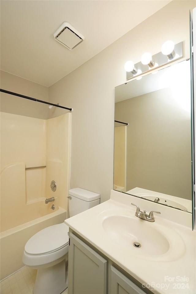 full bathroom featuring bathtub / shower combination, toilet, and vanity