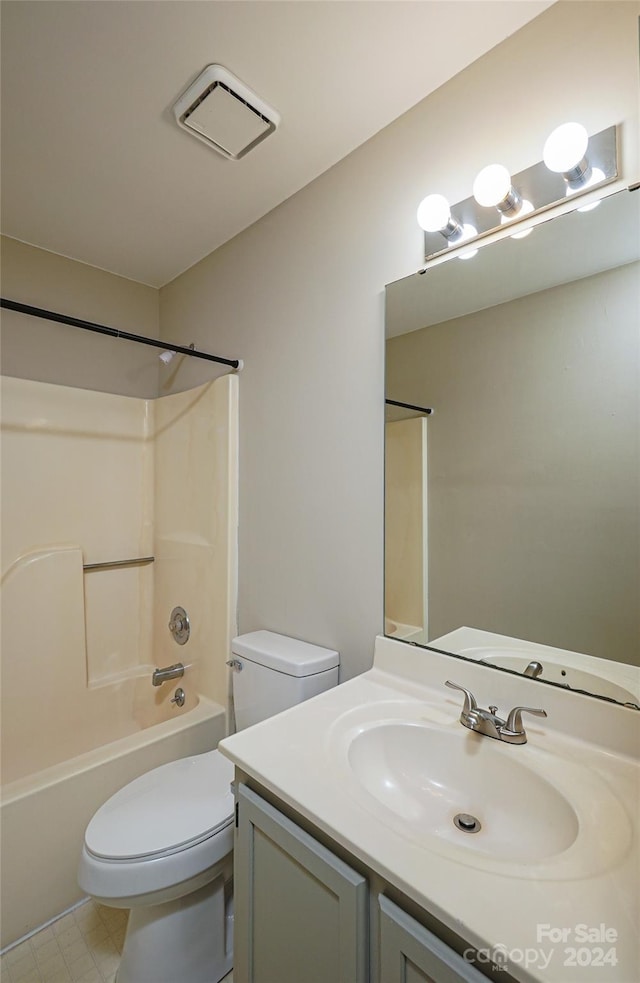 full bathroom with vanity, toilet, and  shower combination