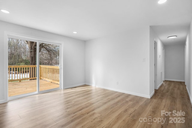 spare room featuring light hardwood / wood-style floors