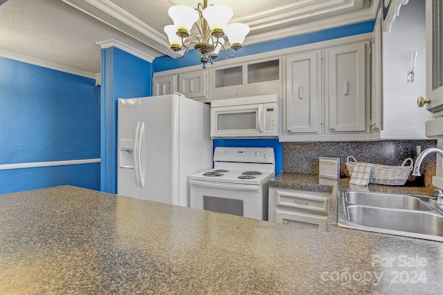 kitchen with a chandelier, white appliances, sink, ornamental molding, and a textured ceiling