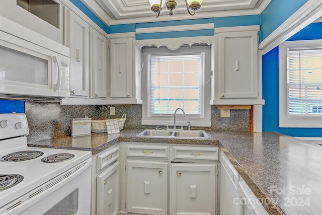 kitchen featuring white cabinets, white appliances, sink, ornamental molding, and backsplash