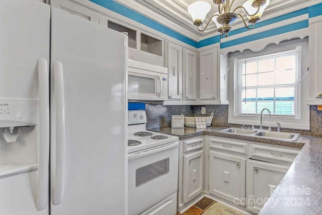 kitchen with white appliances, sink, a chandelier, ornamental molding, and backsplash