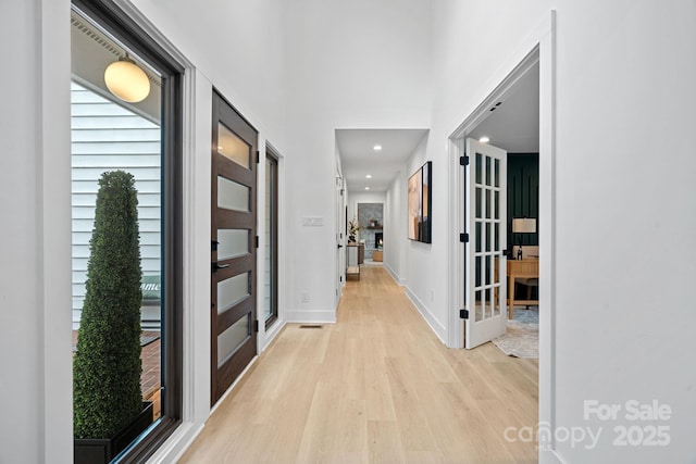 corridor featuring light hardwood / wood-style flooring