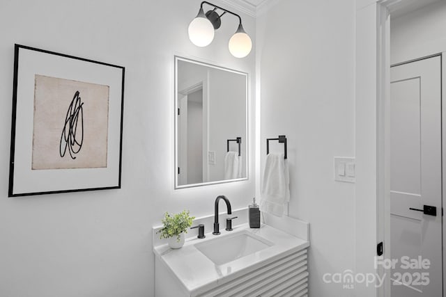 bathroom with vanity and crown molding