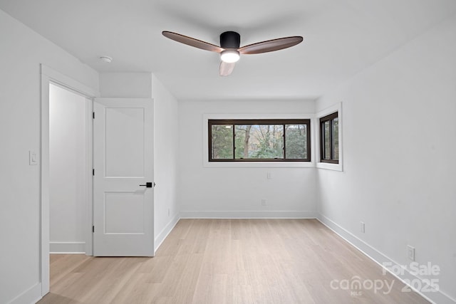 unfurnished bedroom with ceiling fan and light wood-type flooring