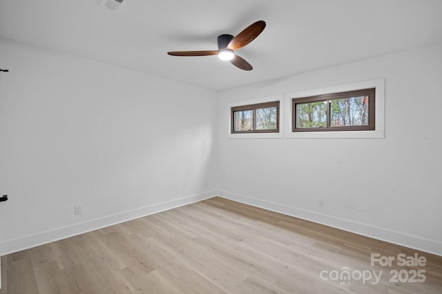 unfurnished room featuring ceiling fan and light wood-type flooring