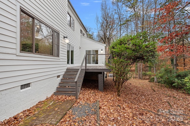 view of side of property featuring a deck