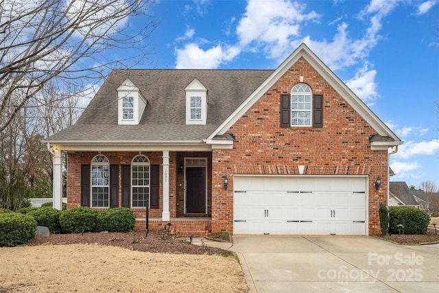 view of front of home featuring a garage, concrete driveway, brick siding, and a shingled roof