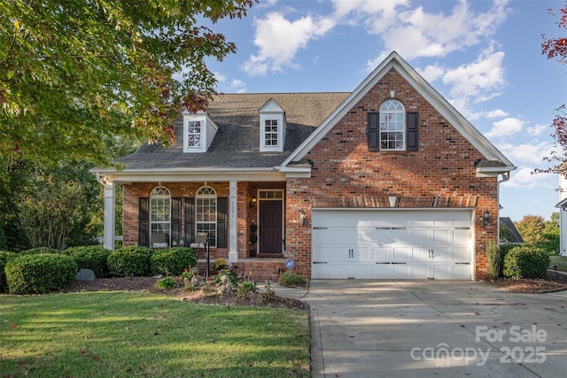 view of front of home with brick siding, a front lawn, roof with shingles, driveway, and an attached garage