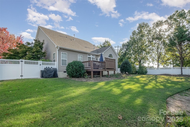 back of house with a wooden deck, crawl space, a lawn, and a fenced backyard