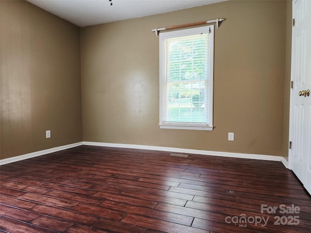 2015 Pine Needle Ct, Gastonia, NC 28056 - empty room with dark wood-style flooring and baseboards