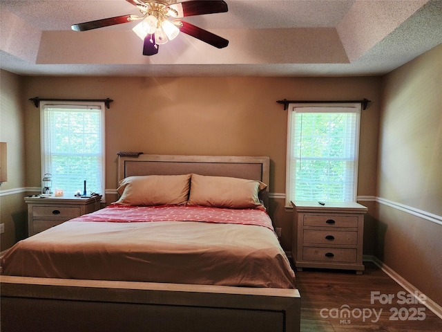 2015 Pine Needle Ct, Gastonia, NC 28056 - bedroom featuring dark wood-type flooring, a ceiling fan, and a textured ceiling