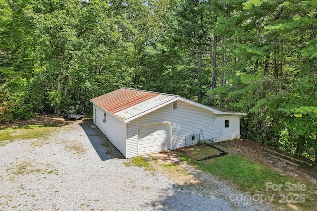 view of property exterior featuring a garage