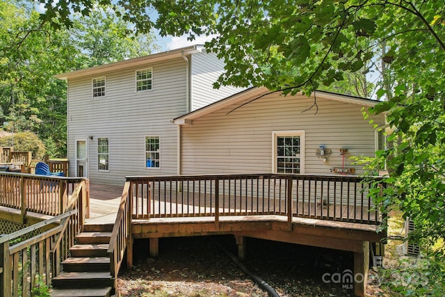 rear view of house with a deck