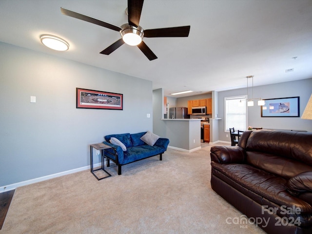 living room featuring light carpet and ceiling fan