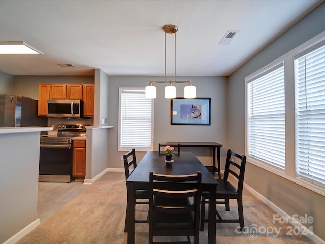 view of carpeted dining room