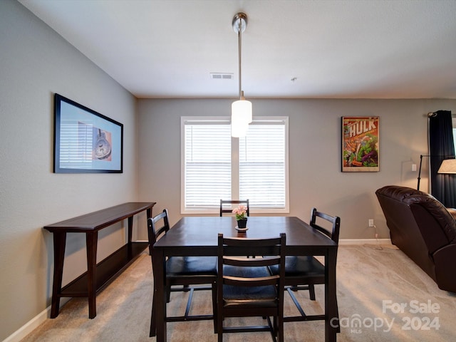 view of carpeted dining space