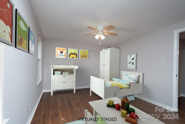 bedroom with ceiling fan and dark hardwood / wood-style flooring