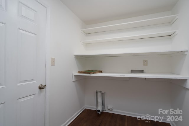 clothes washing area with hookup for a washing machine and dark hardwood / wood-style floors