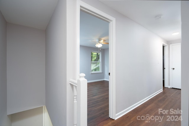 corridor featuring dark wood-type flooring