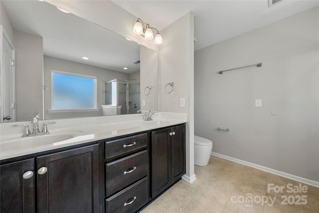 bathroom featuring vanity, toilet, tile patterned flooring, and a shower with door