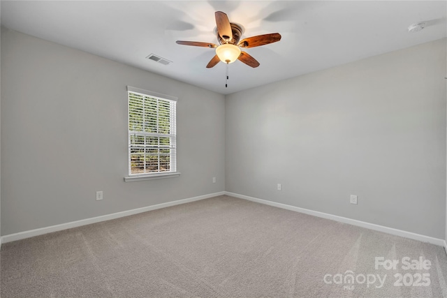 carpeted empty room featuring ceiling fan