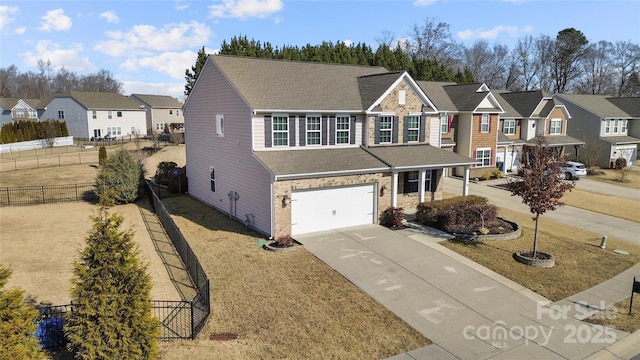 view of front of house with a garage and a front lawn