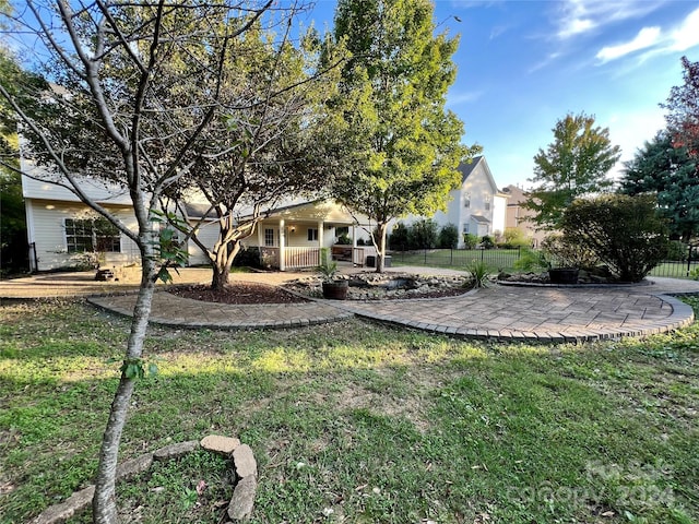 view of yard featuring covered porch