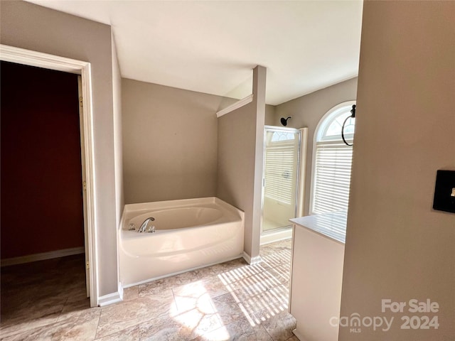 bathroom with independent shower and bath