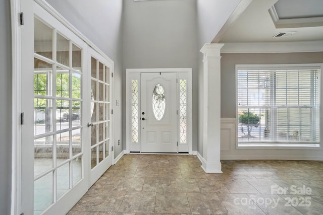 3007 Gambrill Falls Dr, Indian Trail, NC 28079 - entrance foyer with stone finish flooring, ornamental molding, ornate columns, and baseboards