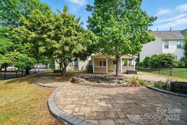 3007 Gambrill Falls Dr, Indian Trail, NC 28079 - view of front of house featuring covered porch and curved driveway
